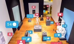 Exhibition room in the Ashmolean Museum of Art and Archaeology with social media symbols next to objects, showing likes and comments across different platforms